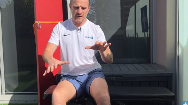 Seated pelvic rocking exercise to release back muscle spasm
